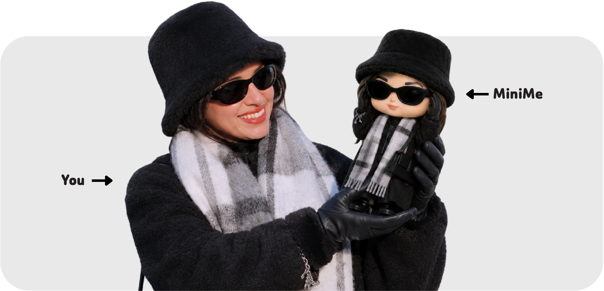 A customer holding her MiniMe figurine next to herself